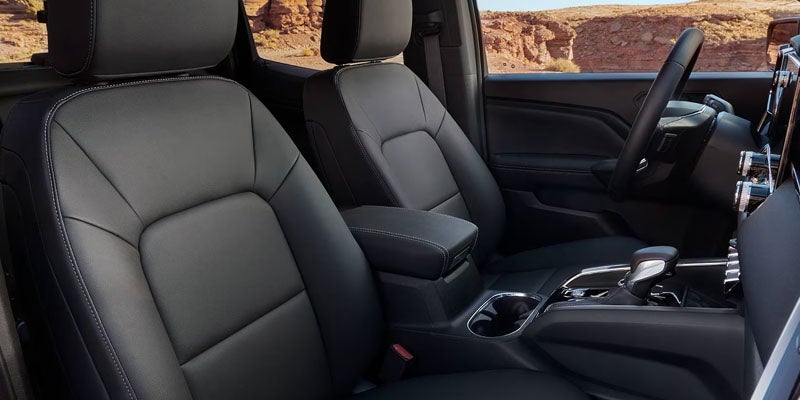 Interior front seating and center console inside the 2026 GMC Canyon